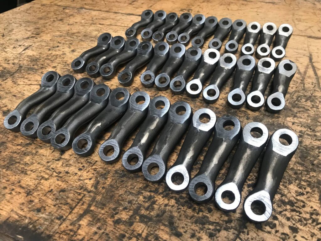 Batch of machined cast steel levers