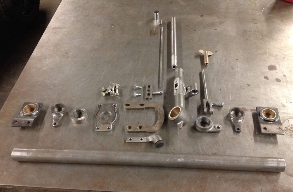 Classic car handbrake components before assembly